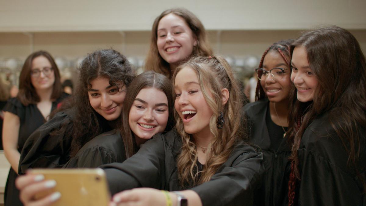 group of teenage girls taking selfie